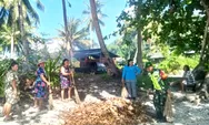 Babinsa Desa Marampit Serka Florianus bersama masyarakat melaksanakan pembersihan lingkungan