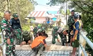 Anggota Koramil 1312-03/Beo Bersama Warga Melaksanakan Karya Bhakti Pembuatan Jembatan