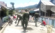 Babinsa Koramil 04/Rainis bersama warga gotong royong pembuatan jalan desa