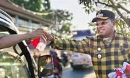 Bersama Jurnalis, Wabup Haris Bagikan 500 Bendera Merah Putih