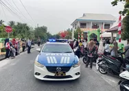Jaga Rute Pawai Maulid Nabi, Satlantas Polres Natuna Hadirkan Rasa Aman bagi Ratusan Siswa SD