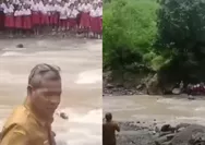 Viral aksi para siswa SD di NTT sambut kepala dinas dari seberang sungai: Ayo maju, jangan ragu!