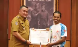 Bupati Bogor Apresiasi FPTI Kibarkan Bendera Merah Putih Terbesar di Tebing Lidah Jegger, Catat Rekor MURI