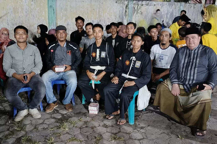 PSHT Kecamatan Teluk Mengkudu Kabupaten Sergai menghadiri acara atraksi pencak silat yang digelar IPSI Kecamatan Tanjung Beringin yang juga dimotori oleh IPSI Kabupaten Sergai. (Realitasonline.id/ ML)